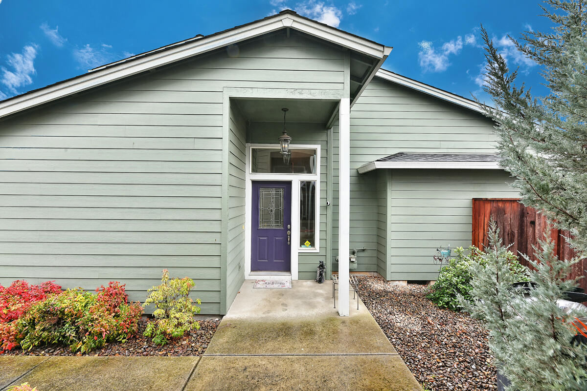 328 Live Oak Loop Central Point, OR 97502 - Photo 2 of 18 a front view of a house with a garage