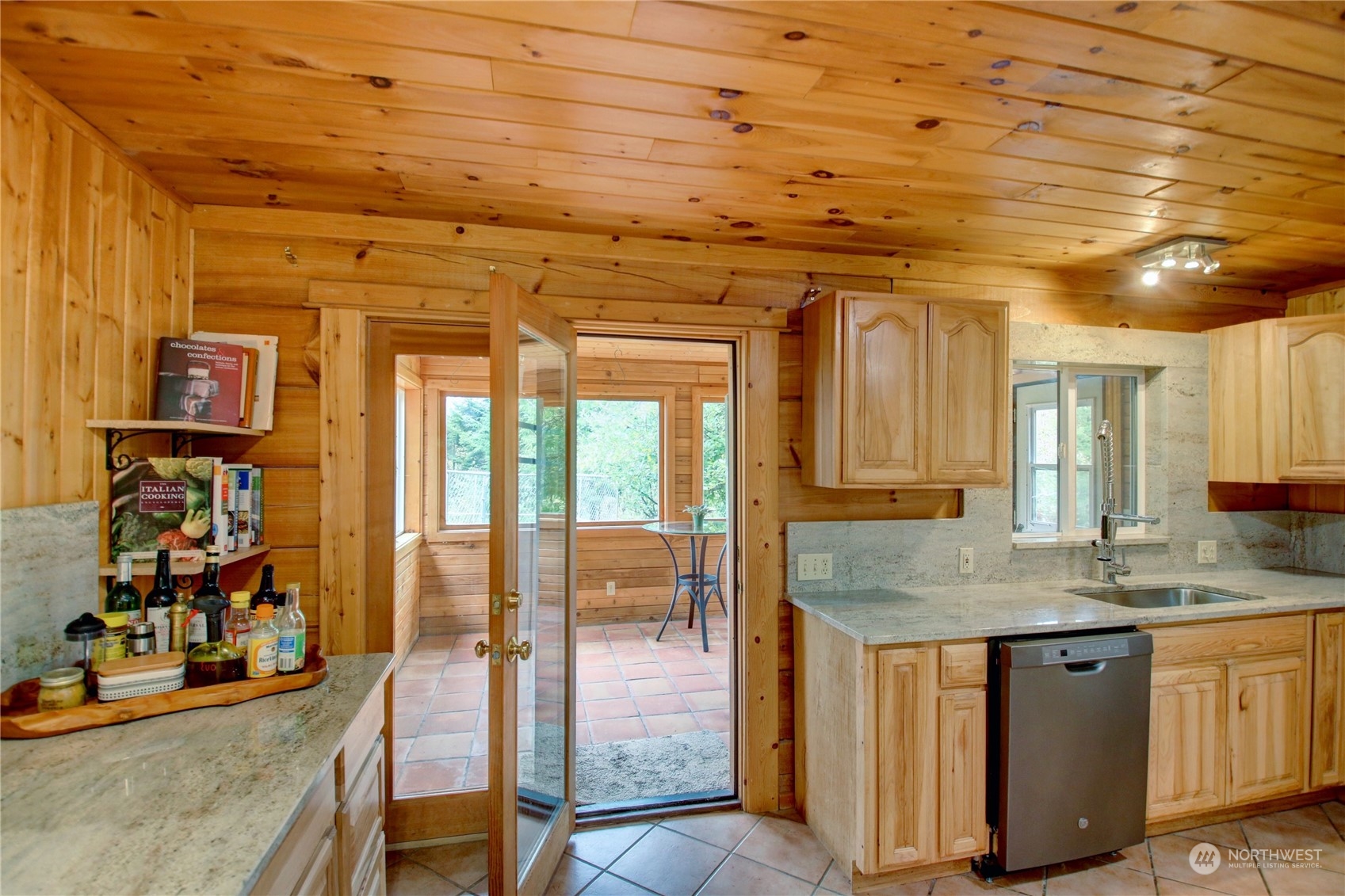 9363 Silver Lake Road Maple Falls, WA 98266 - Photo 11 of 38 a dining hall with stainless steel appliances granite countertop a sink and cabinets