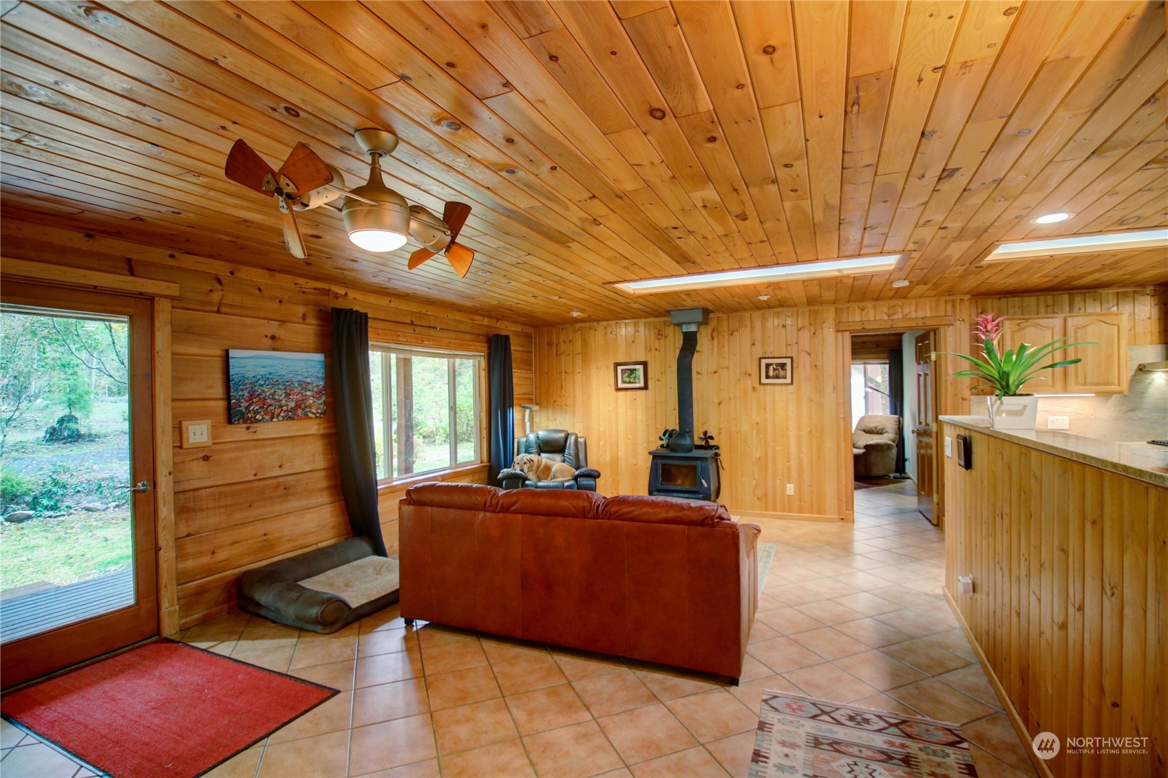 9363 Silver Lake Road Maple Falls, WA 98266 - Photo 15 of 38 a living room with furniture and a flat screen tv