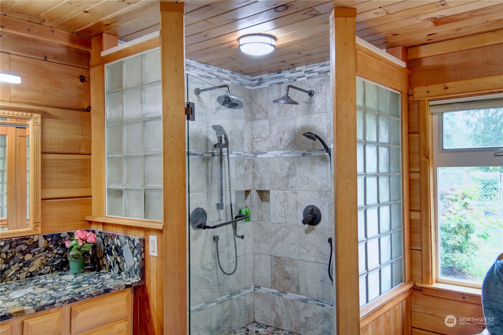 9363 Silver Lake Road Maple Falls, WA 98266 - Photo 18 of 38 a bathroom with a granite countertop shower and a mirror