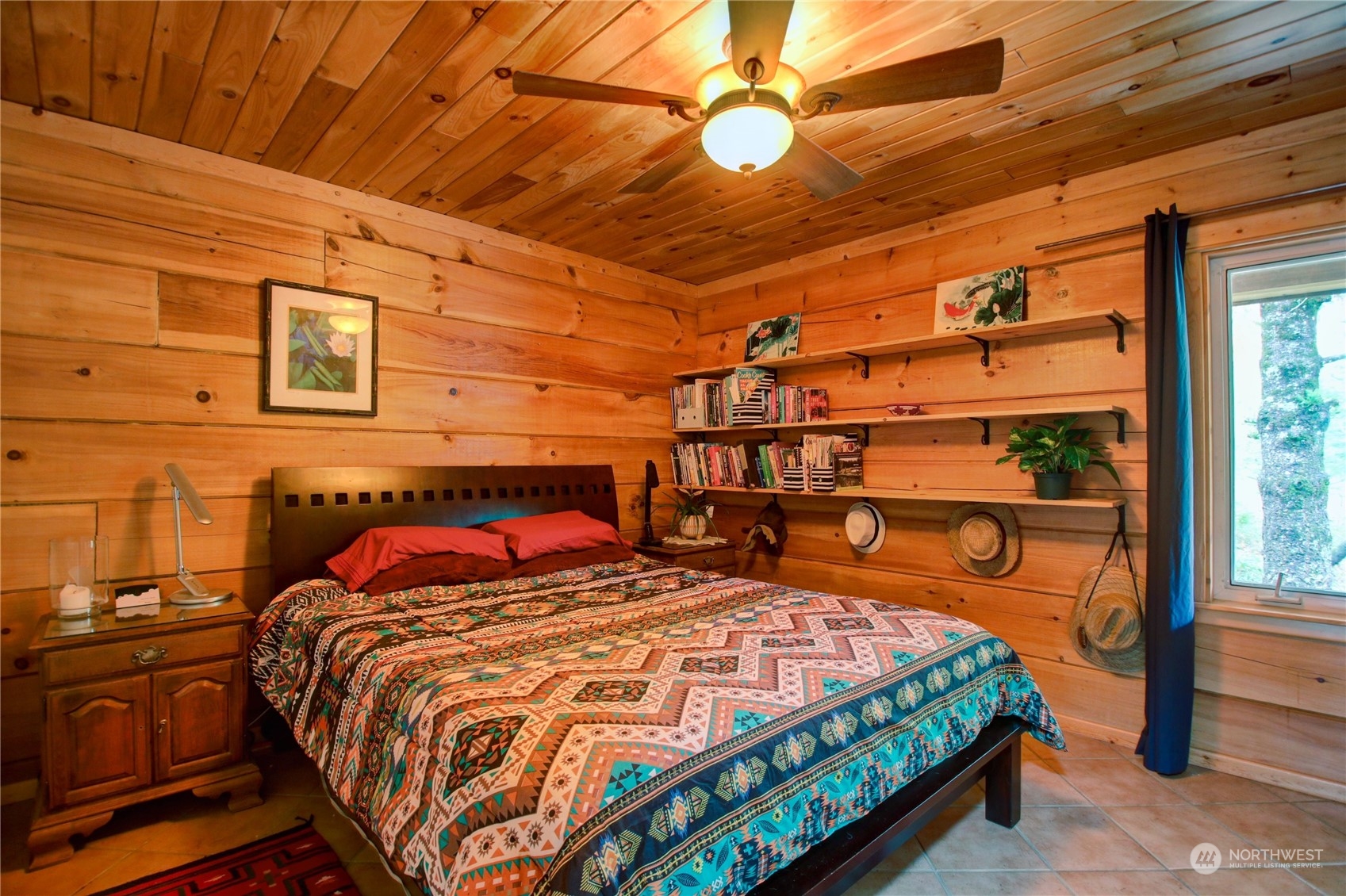 9363 Silver Lake Road Maple Falls, WA 98266 - Photo 21 of 38 a bedroom with a bed a dresser and next to a window