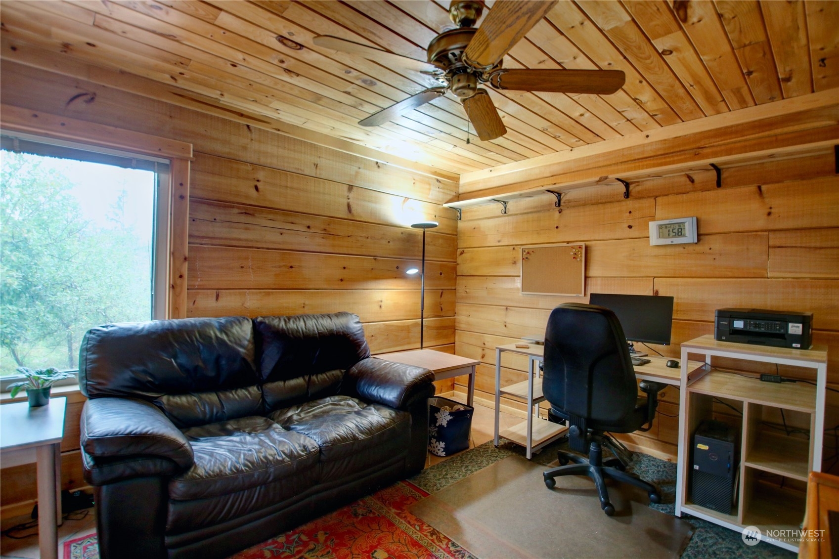 9363 Silver Lake Road Maple Falls, WA 98266 - Photo 22 of 38 a view of a livingroom with workspace and a window