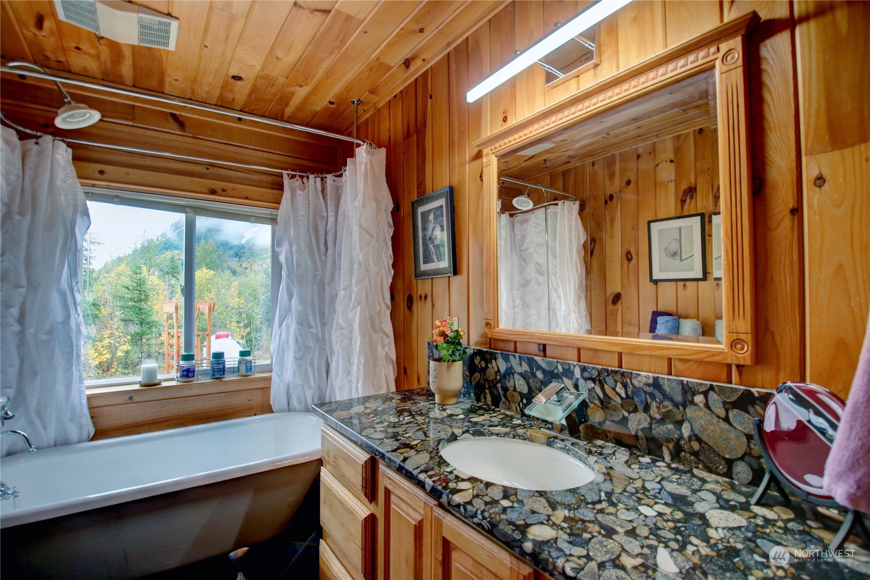 9363 Silver Lake Road Maple Falls, WA 98266 - Photo 23 of 38 a bathroom with a granite countertop sink and a mirror