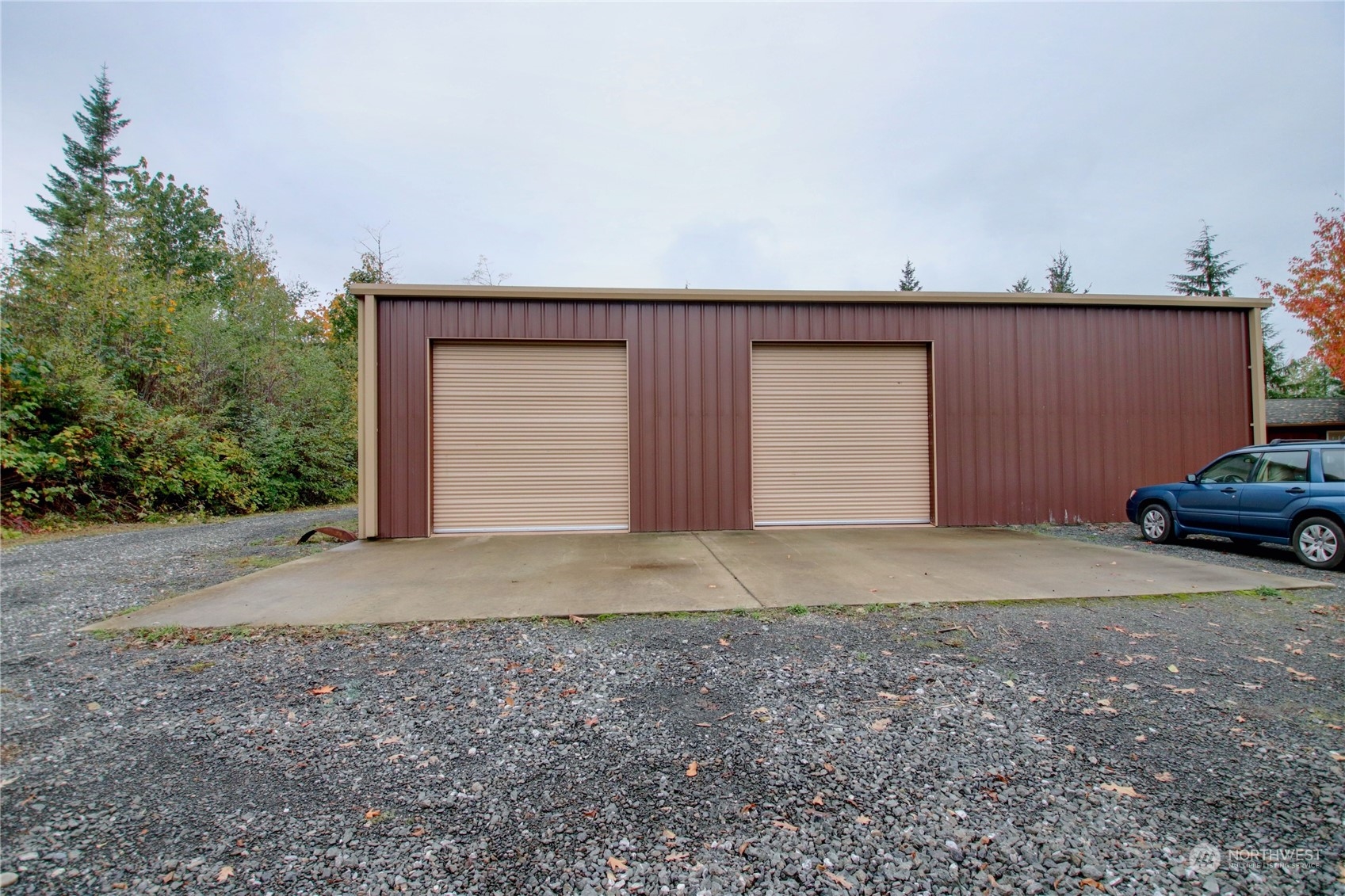 9363 Silver Lake Road Maple Falls, WA 98266 - Photo 28 of 38 a front view of a house with a yard and garage