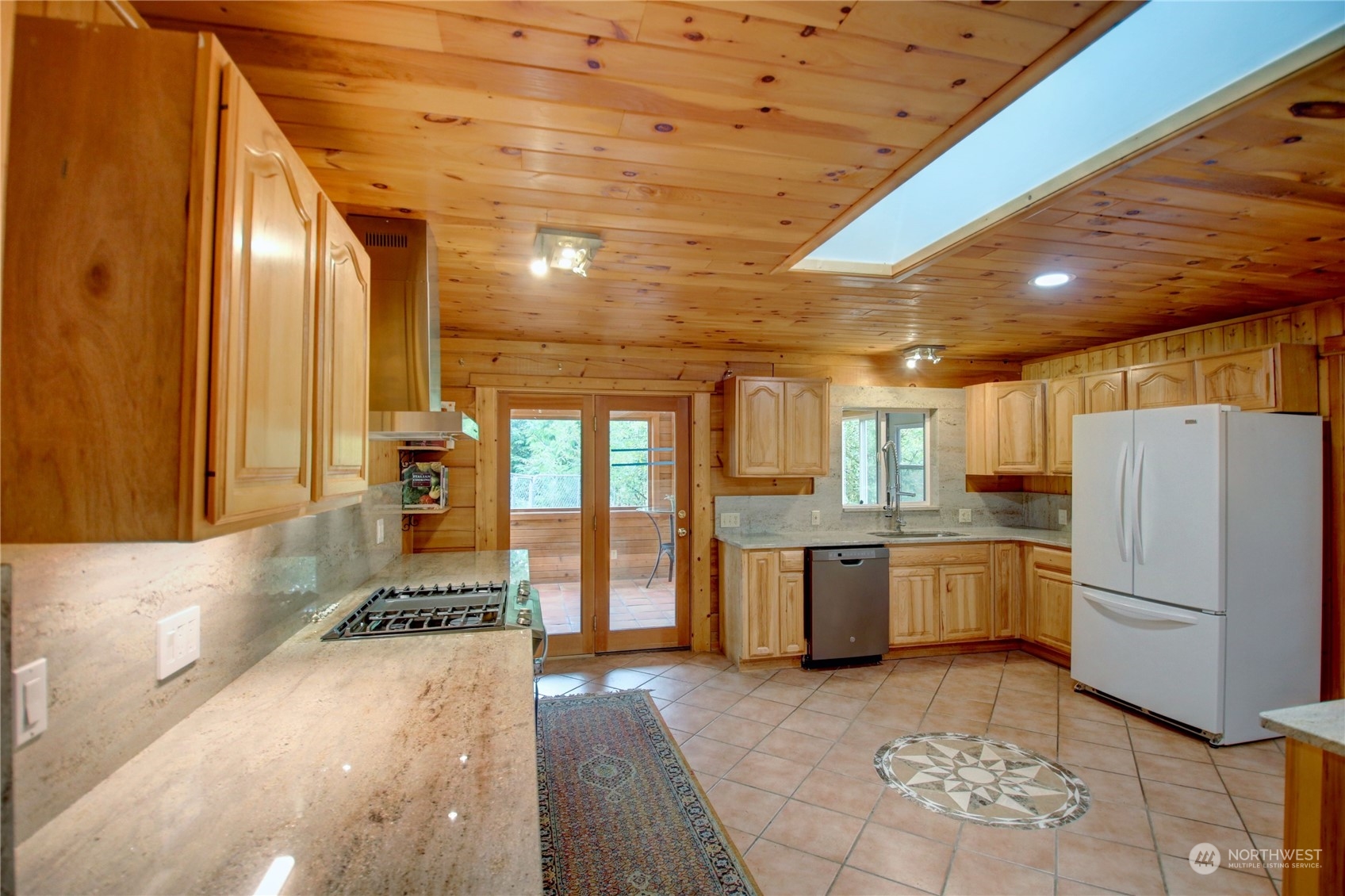 9363 Silver Lake Road Maple Falls, WA 98266 - Photo 8 of 38 a kitchen with refrigerator and window