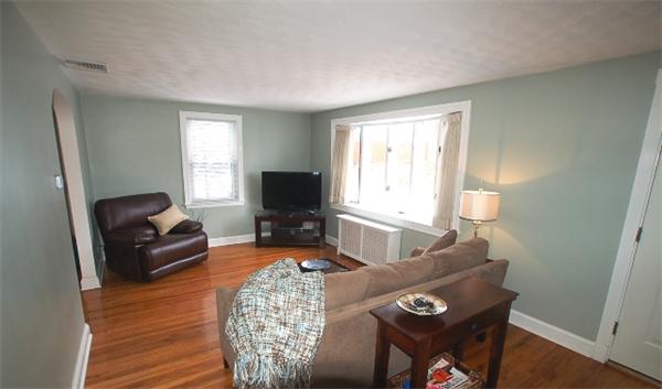 26 Fern Road Medford, MA 02155 - Photo 12 of 27 a living room with furniture and a flat screen tv
