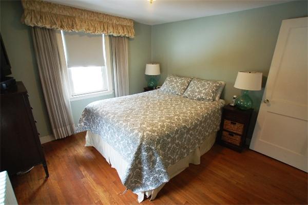 26 Fern Road Medford, MA 02155 - Photo 18 of 27 a bed sitting in a bedroom next to a window