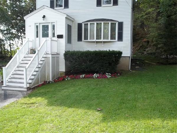 26 Fern Road Medford, MA 02155 - Photo 2 of 27 a front view of a house with a garden and plants