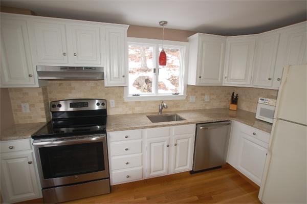 26 Fern Road Medford, MA 02155 - Photo 8 of 27 a kitchen with cabinets appliances and a window