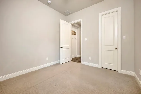 a view of hallway with wooden floor