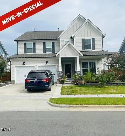 a view of a car parked in front of a house