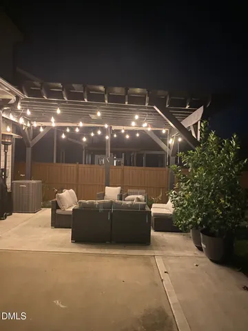 a view of a swimming pool with a patio and a garden