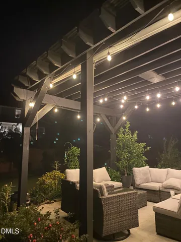 a patio with a yard table and chairs