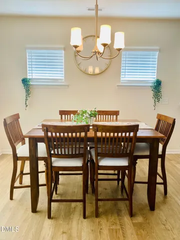 a kitchen with kitchen island granite countertop a sink a counter top cabinets and stainless steel appliances