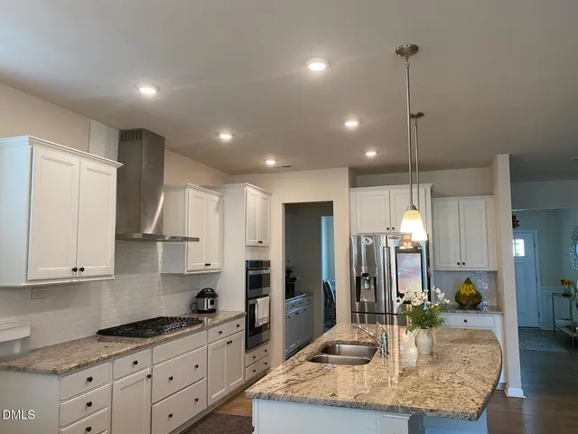 a view of a sink storage and utility