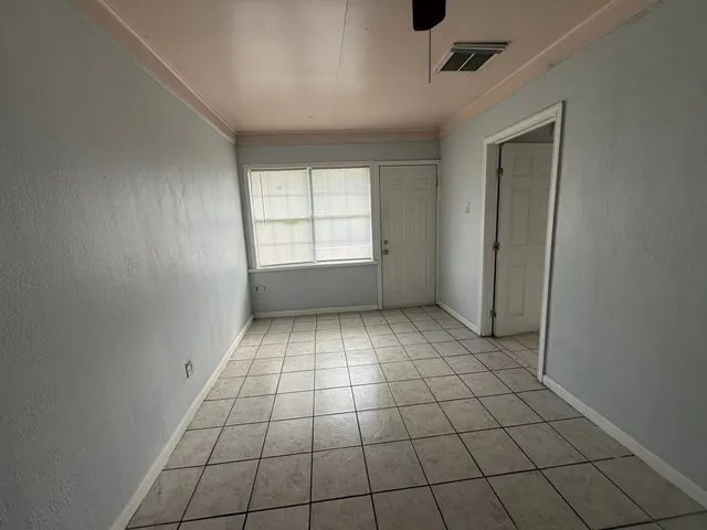 a view of an empty room and window