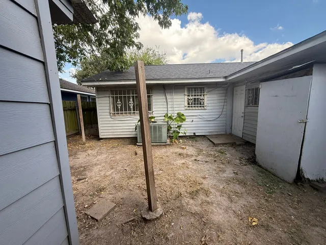 a house view with a backyard space