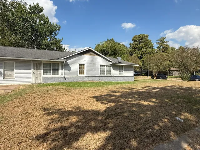 a house with trees in the background
