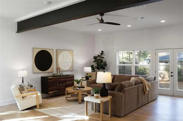 a living room with furniture fireplace and window