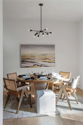 a workspace with furniture and chandelier