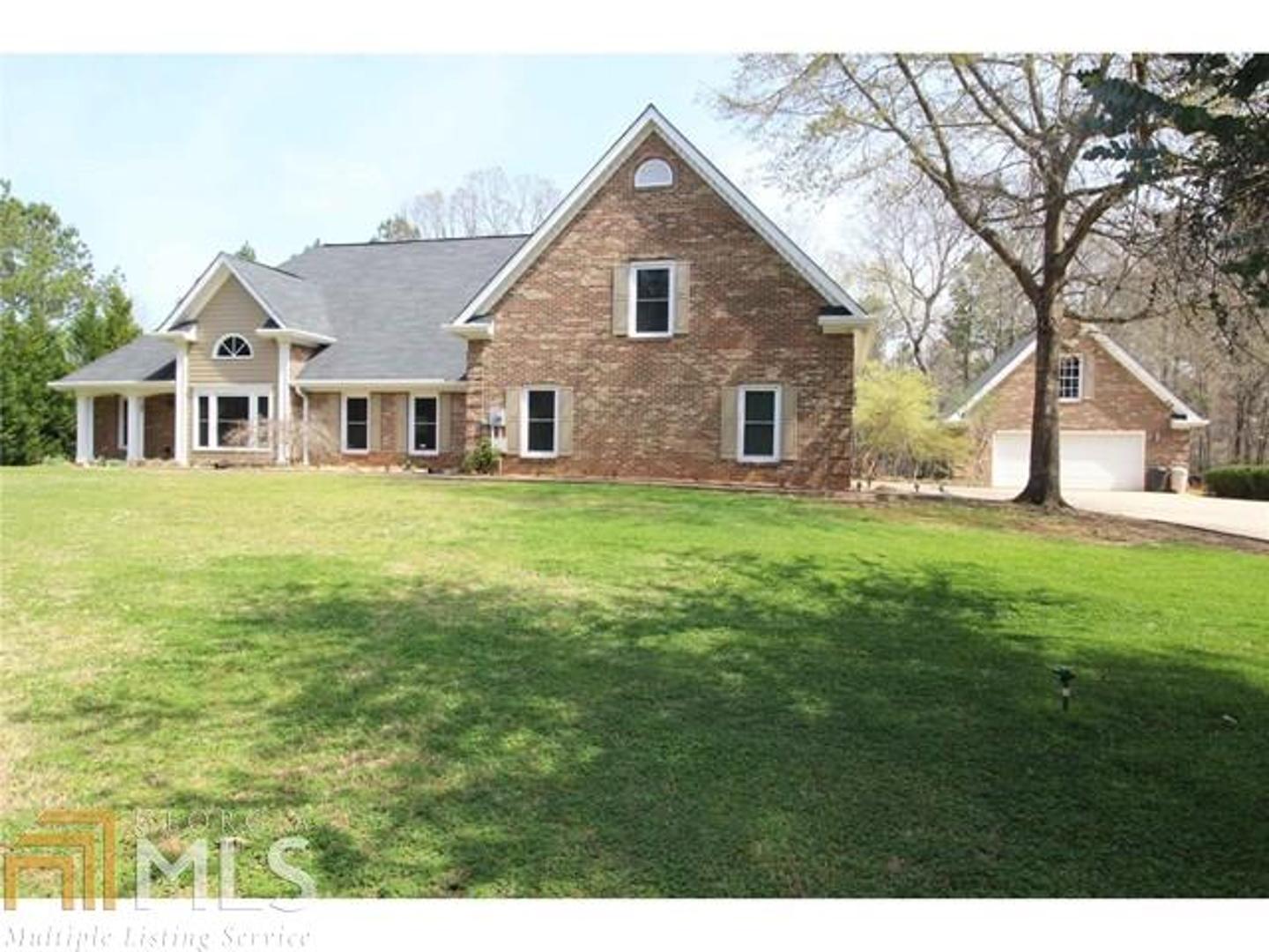 289 Nathan Thaxton Road Jackson, GA 30233 - Photo 1 of 1 a view of a house with a yard