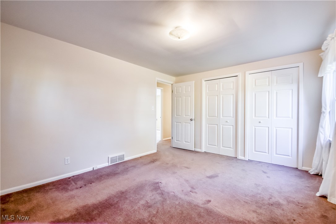 6145 Hemingway Road Cleveland, OH 44143 - Photo 35 of 50 Unfurnished bedroom featuring two closets and carpet flooring