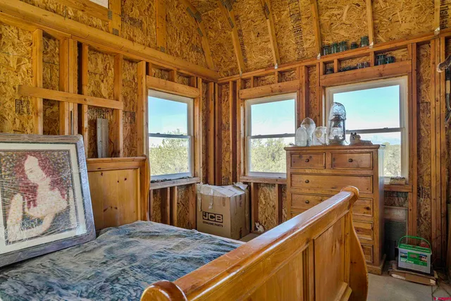 a view of a kitchen with furniture and windows