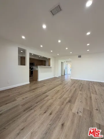 a view of a kitchen with a sink and a window