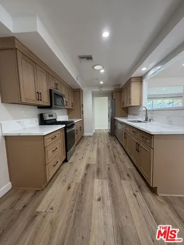 an empty room with wooden floor