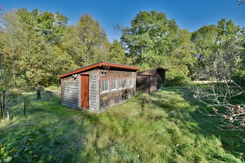 563 Mendon Road Whitinsville, MA 01588 - Photo 11 of 30 a backyard of a house with lots of green space
