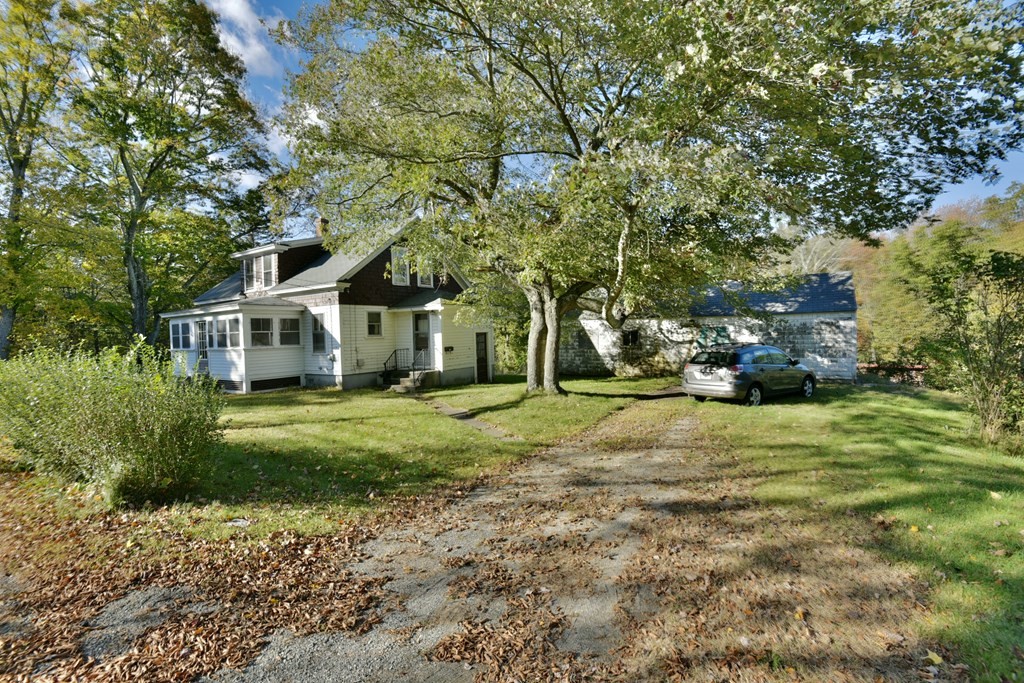 563 Mendon Road Whitinsville, MA 01588 - Photo 16 of 30 a front view of a house with a yard