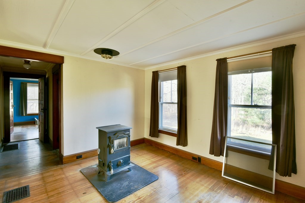 563 Mendon Road Whitinsville, MA 01588 - Photo 18 of 30 a living room with wooden floor and a window