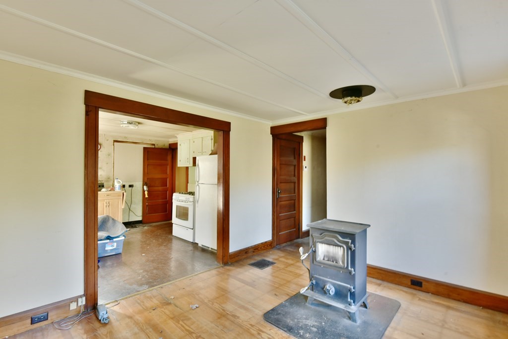 563 Mendon Road Whitinsville, MA 01588 - Photo 19 of 30 a view of a livingroom with wooden floor and a window