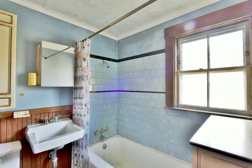 563 Mendon Road Whitinsville, MA 01588 - Photo 21 of 30 a bathroom with a sink and a bathtub
