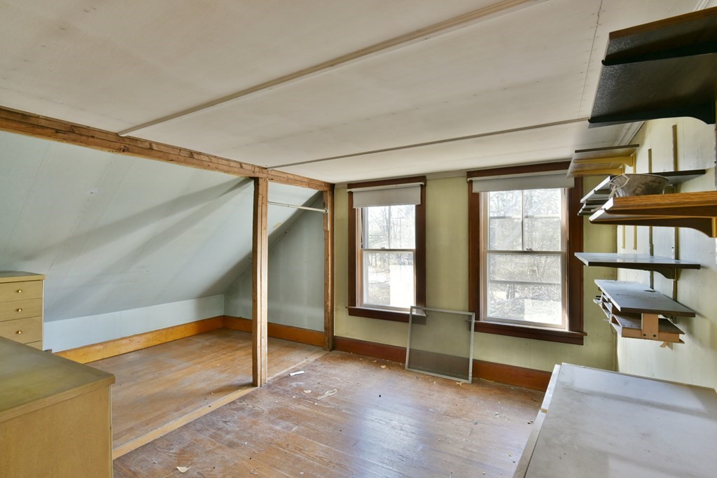 563 Mendon Road Whitinsville, MA 01588 - Photo 28 of 30 a view of an empty room with window and stairs