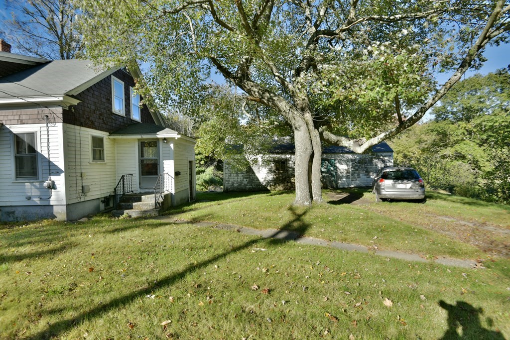 563 Mendon Road Whitinsville, MA 01588 - Photo 3 of 30 a house with trees in front of it