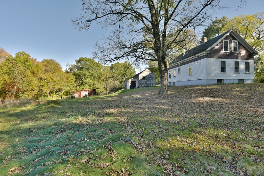 563 Mendon Road Whitinsville, MA 01588 - Photo 5 of 30 a front view of a house with a yard