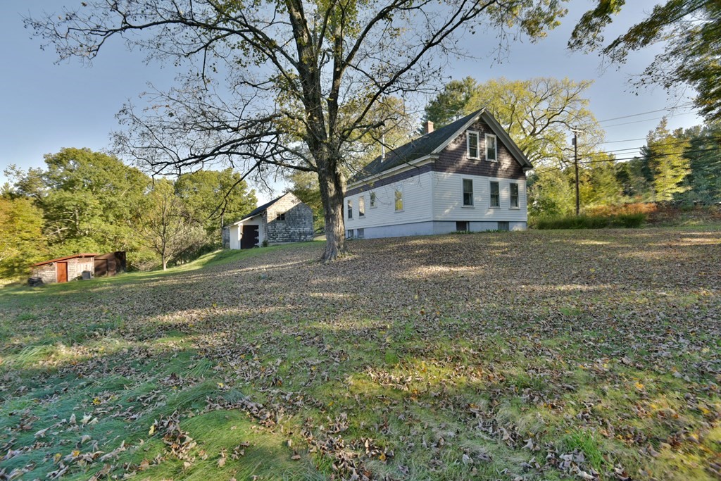 563 Mendon Road Whitinsville, MA 01588 - Photo 6 of 30 a view of a house with a yard