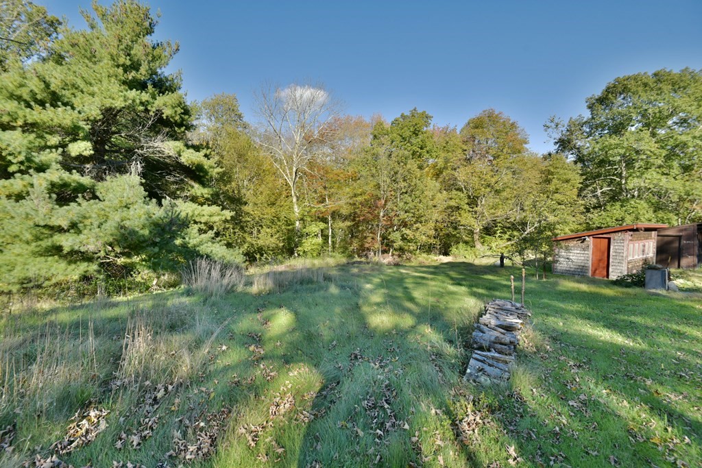 563 Mendon Road Whitinsville, MA 01588 - Photo 10 of 30 a backyard of a house with lots of green space