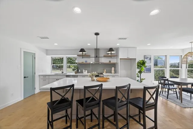 a view of a dining room with furniture window and outside view