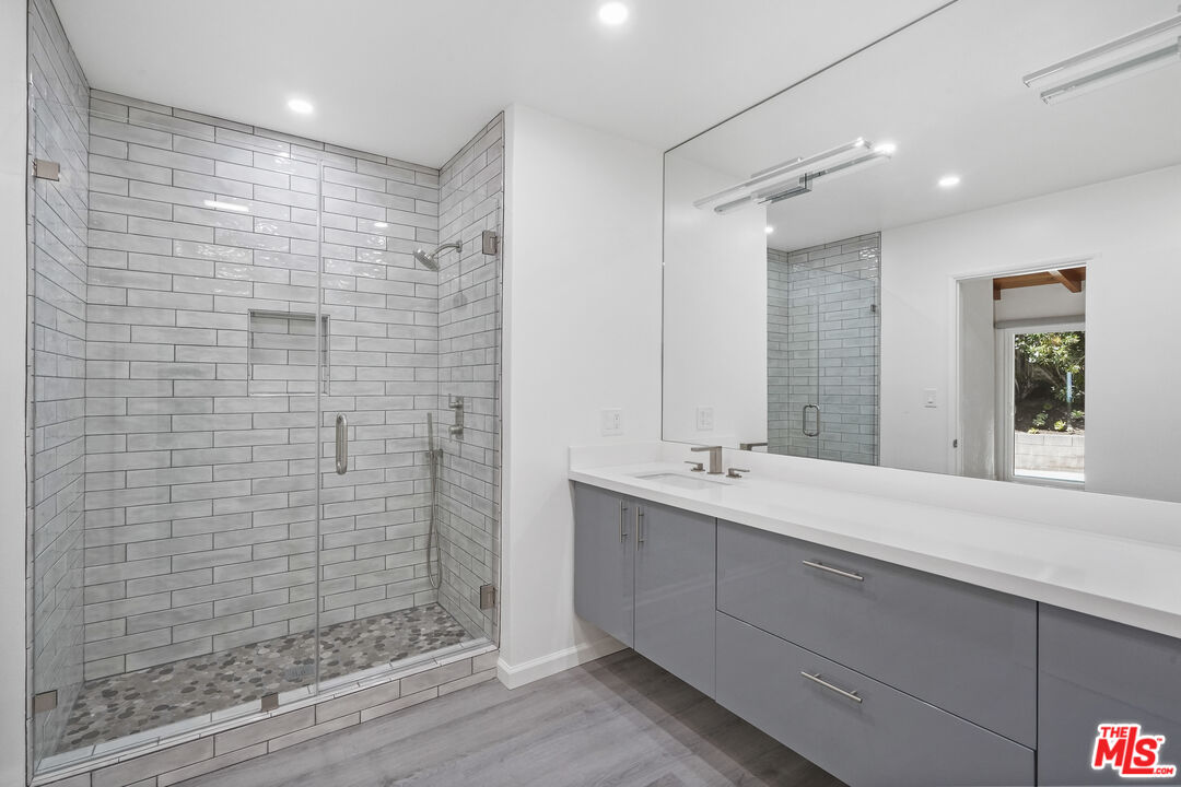 31259 Bailard Road Malibu, CA 90265 - Photo 11 of 41 a bathroom with a double vanity sink mirror and shower