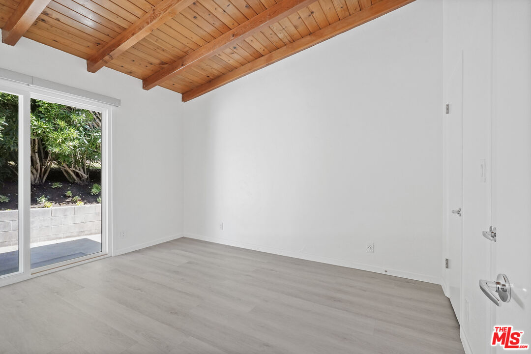 31259 Bailard Road Malibu, CA 90265 - Photo 14 of 41 an empty room with wooden floor and windows