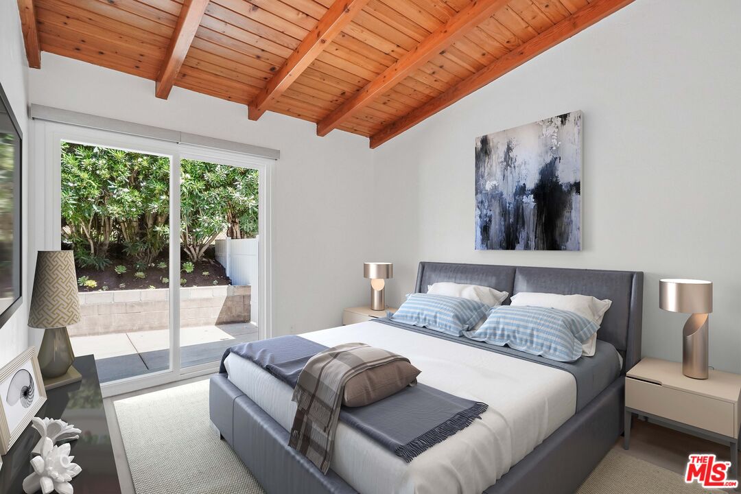 31259 Bailard Road Malibu, CA 90265 - Photo 19 of 41 a bedroom with furniture and large window
