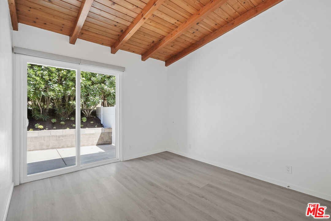 31259 Bailard Road Malibu, CA 90265 - Photo 20 of 41 a view of a room with wooden floor and large windows