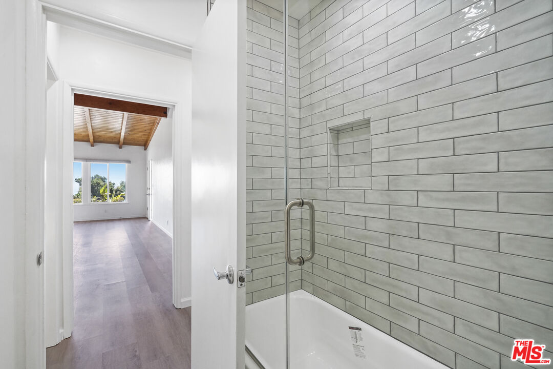 31259 Bailard Road Malibu, CA 90265 - Photo 22 of 41 a bathroom with a bathtub and shower