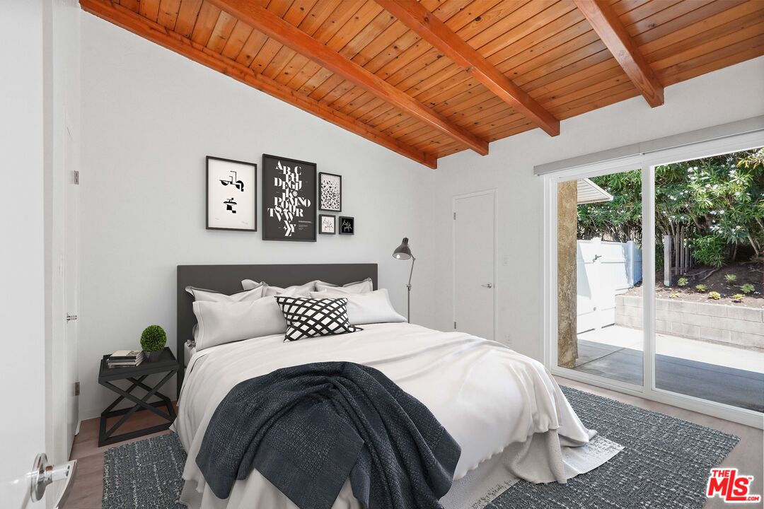 31259 Bailard Road Malibu, CA 90265 - Photo 8 of 41 a bedroom with a bed and a large window