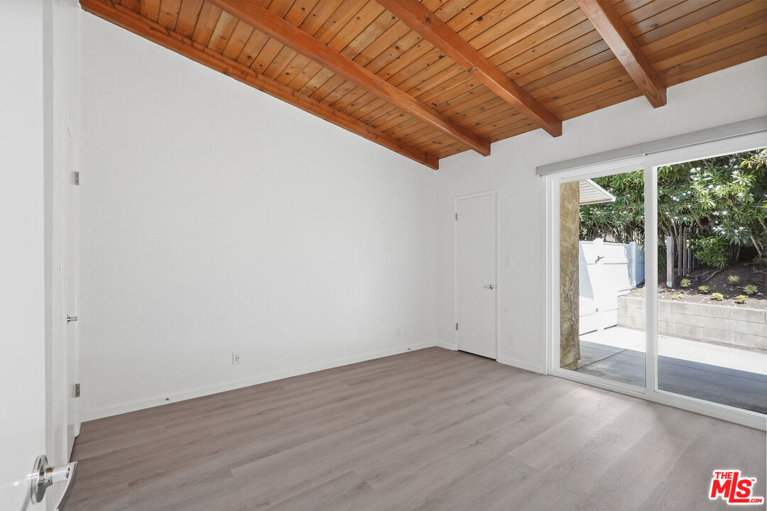 31259 Bailard Road Malibu, CA 90265 - Photo 9 of 41 a view of empty room with wooden floor and fan