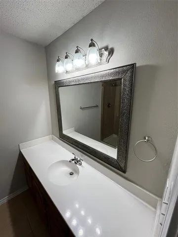 a bathroom with a sink double vanity and a mirror