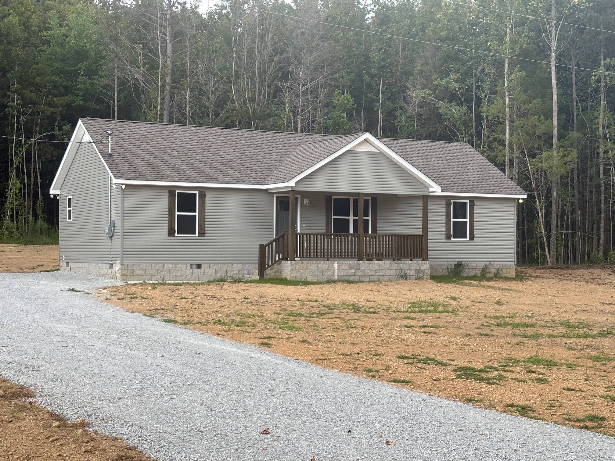 2303 Charley Davis Road Goodspring, TN 38460 - Photo 1 of 16 a house with trees in the background