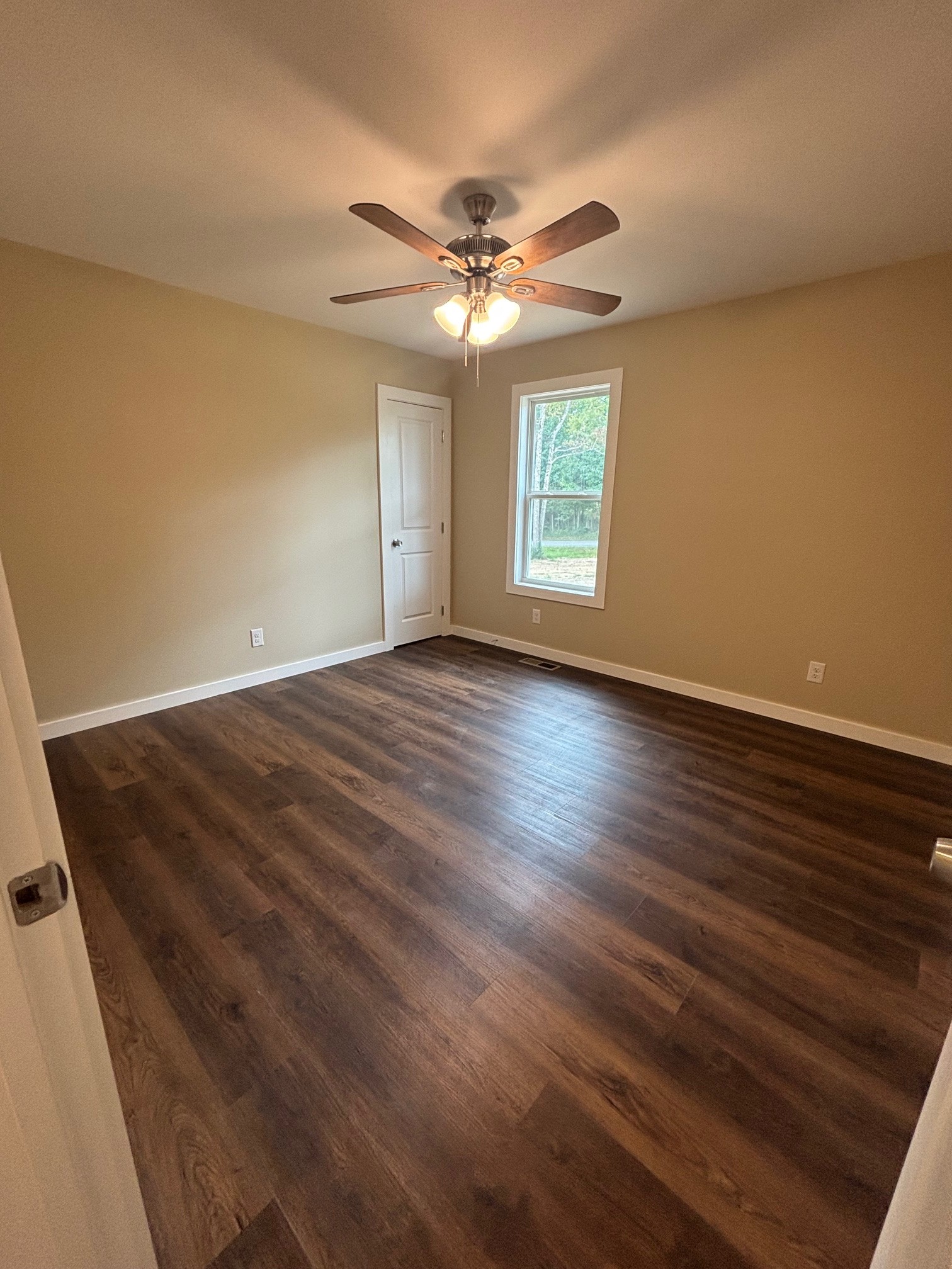 2303 Charley Davis Road Goodspring, TN 38460 - Photo 13 of 16 wooden floor in an empty room with a window